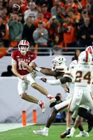 some boys pushing a boy